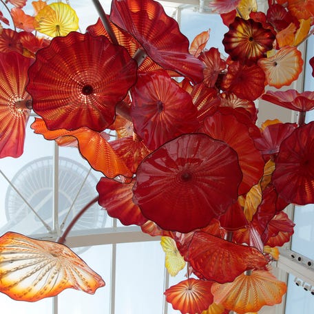 The Space Needle rises above the walls and ceiling of the Chihuly Garden and Glass exhibit in Seattle, Washington, May 16, 2012. REUTERS/Robert Sorbo (UNITED STATES)