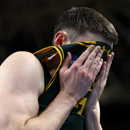 Brendan Coyle #21 of the Siena Saints reacts after the game against the Duke Blue Devils in the first round of the 2026 NCAA Men's Basketball Tournament at Bon Secours Wellness Arena on March 19, 2026 in Greenville, SC. The Duke Blue Devils defeated the Siena Saints 71-65.