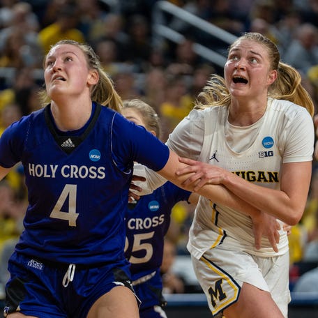 Michigan guard Olivia Olson (1) prepares to get a rebound against a Holy Cross player at the Crisler Center in Ann Arbor on Friday, March 20, 2026.