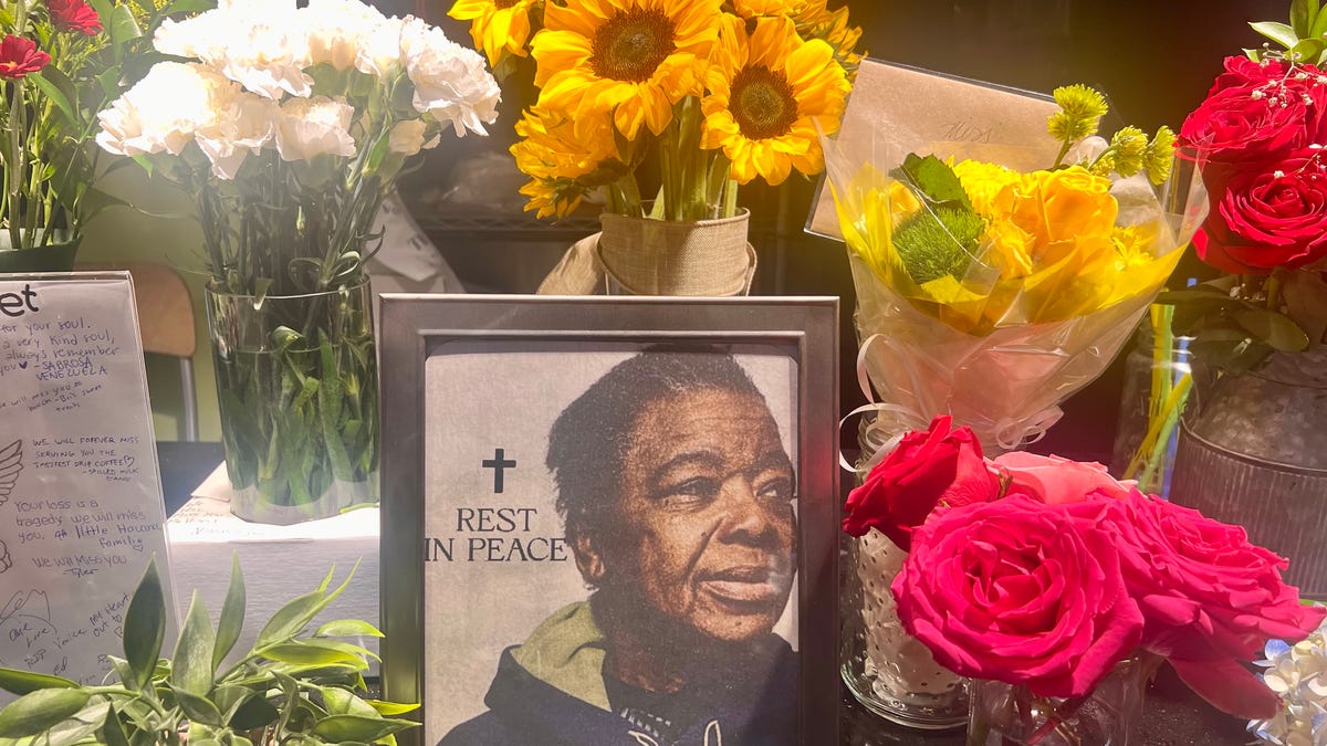 A shrine for Venice Fouchard, owner of One Love Ma Maebelle's Café at Worcester Public Market who died Thursday, March 19, set up at the Worcester Public Market Sunday, March 22.