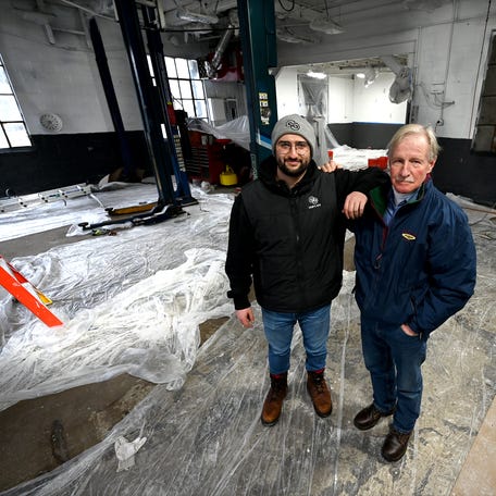 March 10, after 75 years in business at 32 Main St., Sutton, Bek’s Fuels' former owner Stephen Bek Jr., right, transferred ownership to Tony Elias of Sam's Gas. Both stand in the garage that is currently being painted.