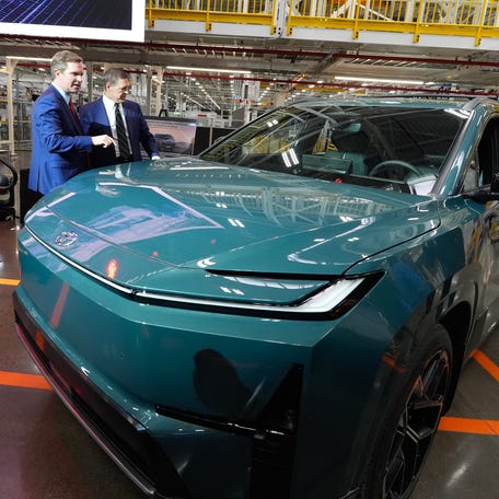 Governor Andy Beshear looks of the 2027 Toyota Highlander EV that will be built at the Georgetown plant. He's being shown the vehicle by Mark Templin EVP & COO to Toyota Motor North America. March 23, 2026