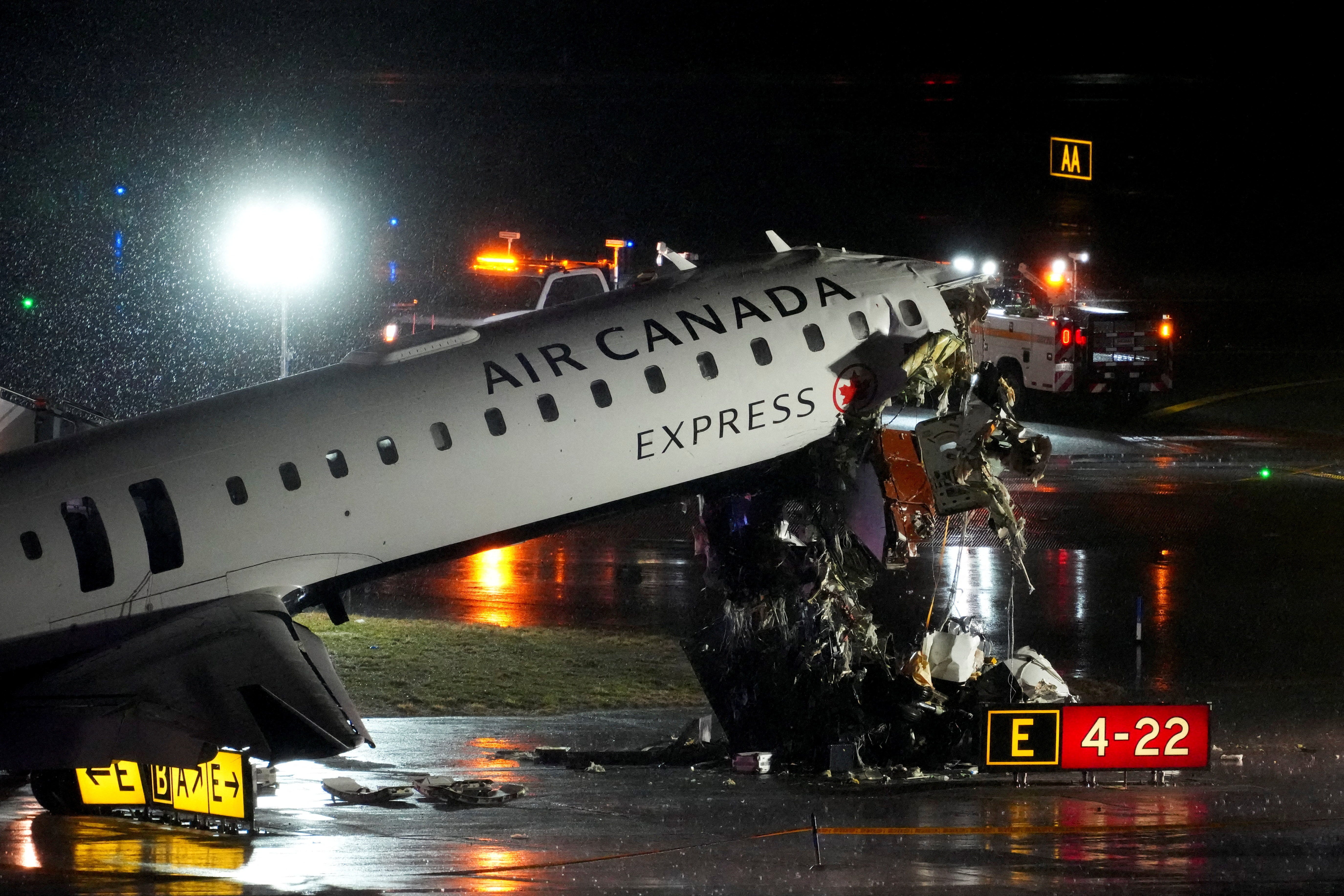 The pilot and co-pilot of an Air Canada Express regional jet were killed after it collided with a fire truck while landing at New York's LaGuardia airport.