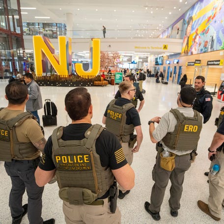 U.S. Immigration and Customs Enforcement agents gather while patrolling around Terminal A at Newark Liberty International Airport on Monday, March 23, 2026, in Newark.