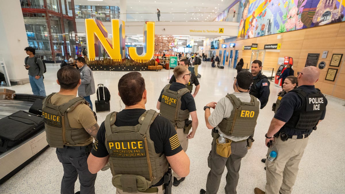 U.S. Immigration and Customs Enforcement agents gather while patrolling around Terminal A at Newark Liberty International Airport on Monday, March 23, 2026, in Newark.