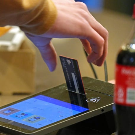 A customer at Erie Insurance Arena checks out with a credit card during an Erie Otters game in Erie, Pa., on Feb. 5, 2026.