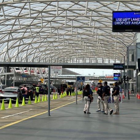 ICE agents were seen standing outside, walking around baggage claim and watching lines inside the terminal at Hartsfield-Jackson Atlanta International Airport on Monday. It was the first day the agency deployed at airports across the country.