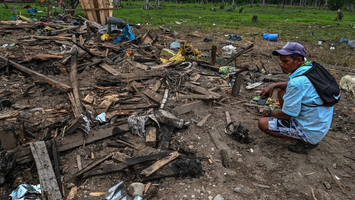 Farmer Vicente Garrido checks the damage caused by a bomb dropped by the Ecuadorian army in San Martin, Lago Agrio region, Sucumbios province, Ecuador, on the border with Colombia, on March 18, 2026.