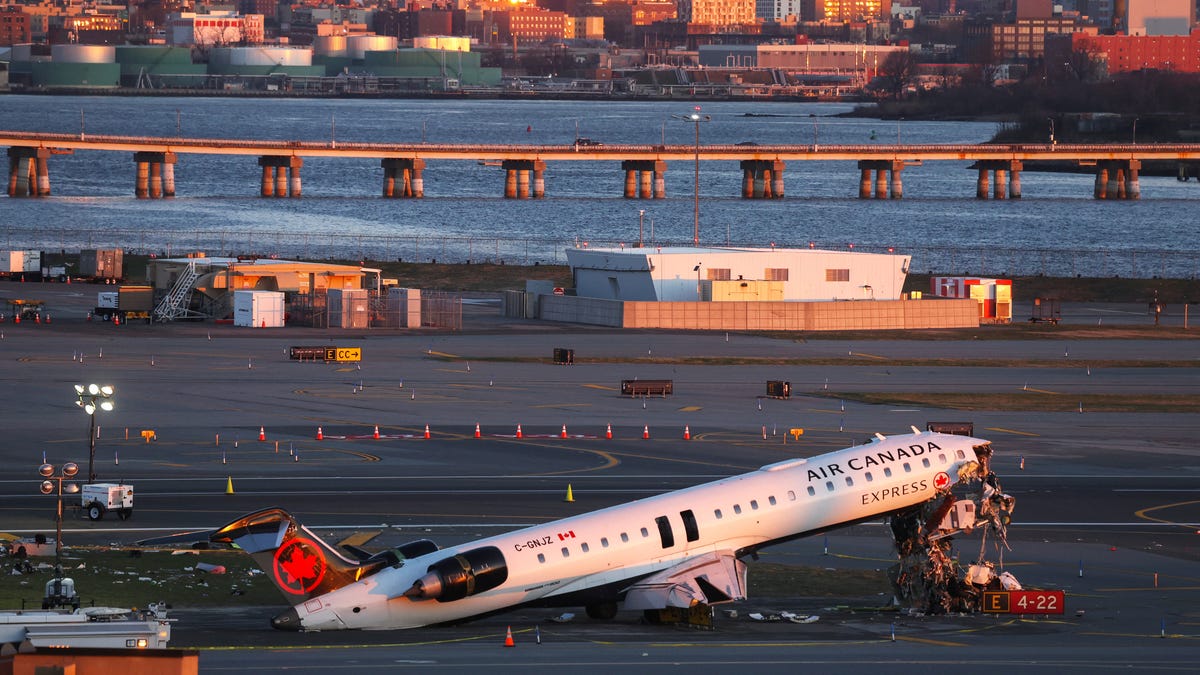 The wreckage of an Air Canada Express jet that collided with a fire truck at New York's LaGuardia Airport on March 22, 22026.