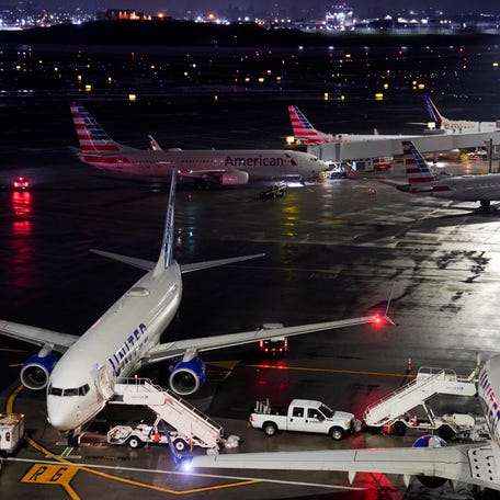 Grounded aircraft operated by United Airlines and American Airlines, after an Air Canada Express jet collided with a ground vehicle at La Guardia Airport in Queens, New York, U.S. March 23, 2026.