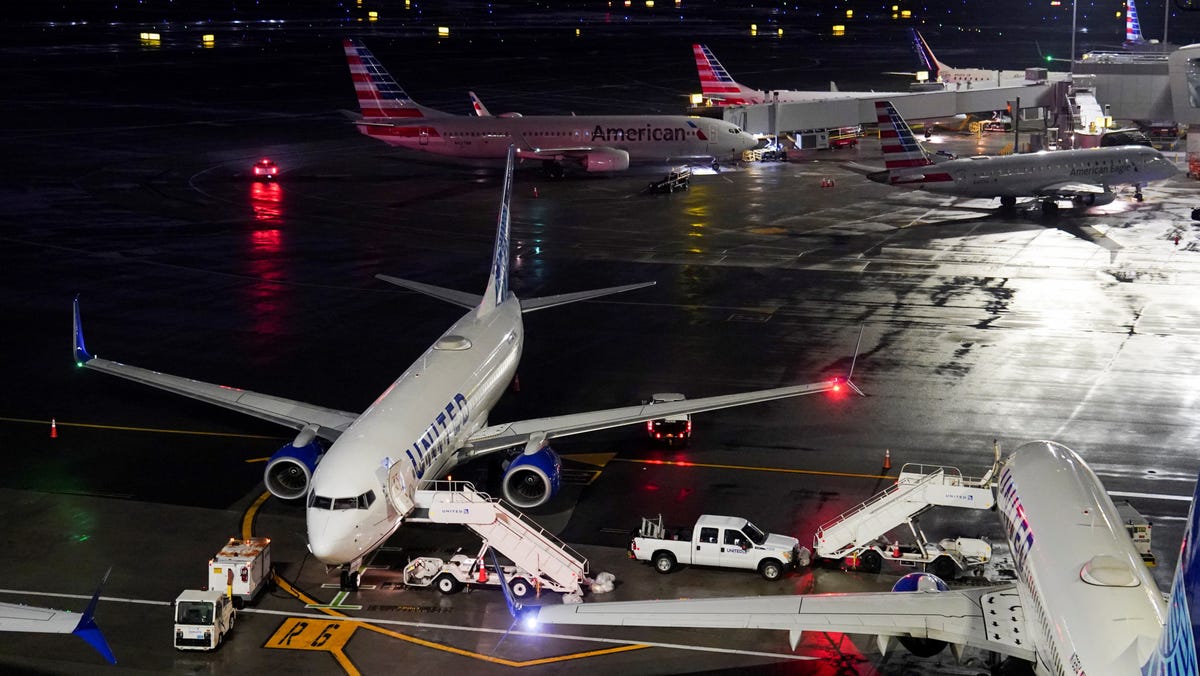 Grounded aircraft operated by United Airlines and American Airlines, after an Air Canada Express jet collided with a ground vehicle at La Guardia Airport in Queens, New York, U.S. March 23, 2026.