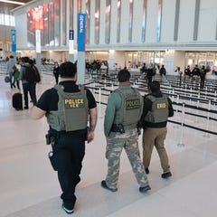 Immigration and Customs Enforcement (ICE) agents patrol Terminal C at LaGuardia Airport on March 24, 2026 in New York, New York.