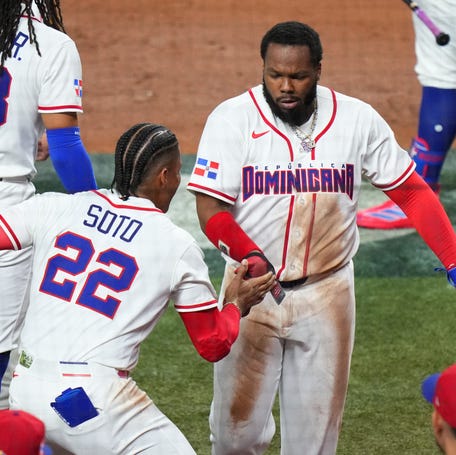 MIAMI, FLORIDA - MARCH 13: Juan Soto #22 celebrates with Vladimir Guerrero Jr. #27 of Team Dominican Republic in the second inning of the quarterfinal game against Team Korea in the 2026 World Baseball Classic at loanDepot park on March 13, 2026 in Miami, Florida. (Photo by Rich Storry/Getty Images)