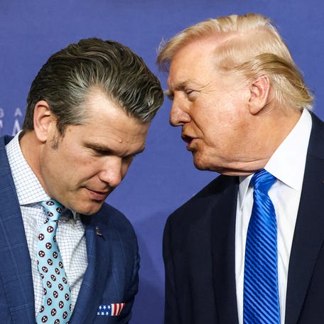 President Donald Trump speaks with Defense Secretary Pete Hegseth at a National Guard base in Memphis, Tennessee, on March 23, 2026.