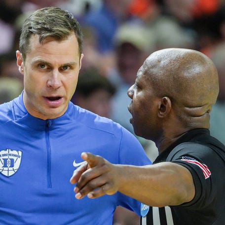 Duke Blue Devils head coach Jon Scheyer talks to a referee March 21, 2026 during the second half of the NCAA Men's Basketball Tournament second round East Region game with TCU at the Bon Secours Wellness Arena in Greenville, South Carolina.