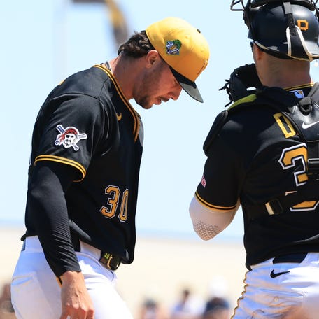 Mar 21, 2026; Bradenton, Florida, USA; Pittsburgh Pirates catcher Henry Davis (32) comes to the mound to talk with starting pitcher Paul Skenes (30) during the third inning against the Toronto Blue Jays at LECOM Park. Mandatory Credit: Kim Klement Neitzel-Imagn Images