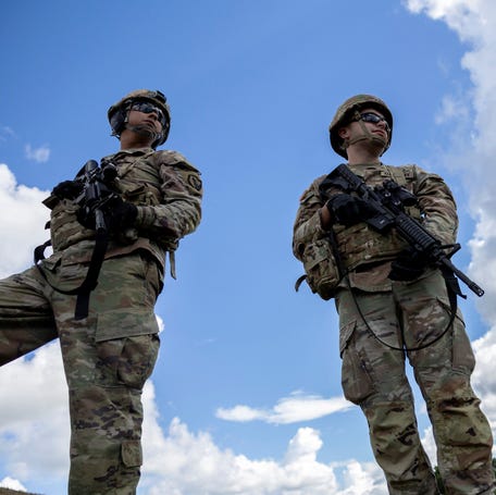 U.S. Army Reserve troops await clearance to enter a shooting range during a live-fire training exercise at Camp Santiago in Salinas, Puerto Rico, on Jan. 10, 2026.