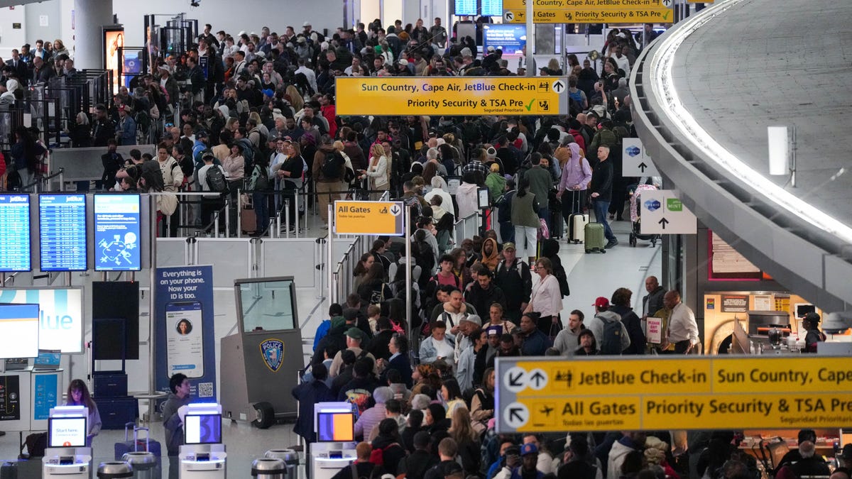 People wait in TSA security lines at John F. Kennedy International Airport, New York City, U.S. March 23, 2026.