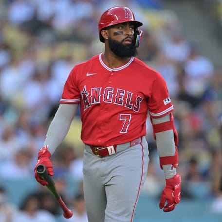 Los Angeles Angels right fielder Jo Adell returns to the dugout after he was called out on strikes during the fourth inning against the Los Angeles Dodgers at Dodger Stadium.