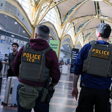 U.S. Immigration and Customs Enforcement agents patrol at Reagan Washington National Airport in Arlington, Virginia, on March 24, 2026.