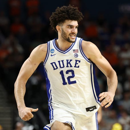 GREENVILLE, SOUTH CAROLINA - MARCH 21: Cameron Boozer #12 of the Duke Blue Devils runs downt the court against the Texas Christian University Horned Frogs during the second half in the second round of the 2026 NCAA Men's Basketball Tournament at Bon Secours Wellness Arena on March 21, 2026 in Greenville, South Carolina.