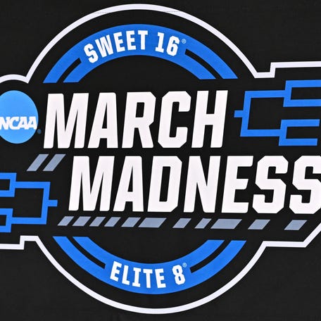 Mar 25, 2026; Houston, TX, USA; A detailed view of the March Madness Sweet 16 Elite 8 logo during a practice session press conference ahead of the south regional of the men's 2026 NCAA Tournament at Toyota Center. Mandatory Credit: Maria Lysaker-Imagn Images