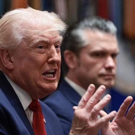Defense Secretary Pete Hegseth listens to President Donald Trump address a Cabinet meeting at the White House in Washington, DC, on March 26, 2026.
