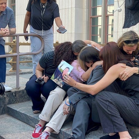 Survivor parents embrace with emotion following the verdict that held Meta and Google liable in a landmark trial.