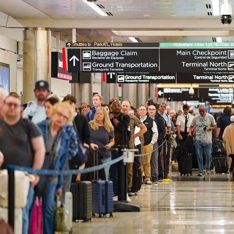 Travelers wait in long lines at Hartsfield-Jackson Atlanta International Airport on March 26, 2026.