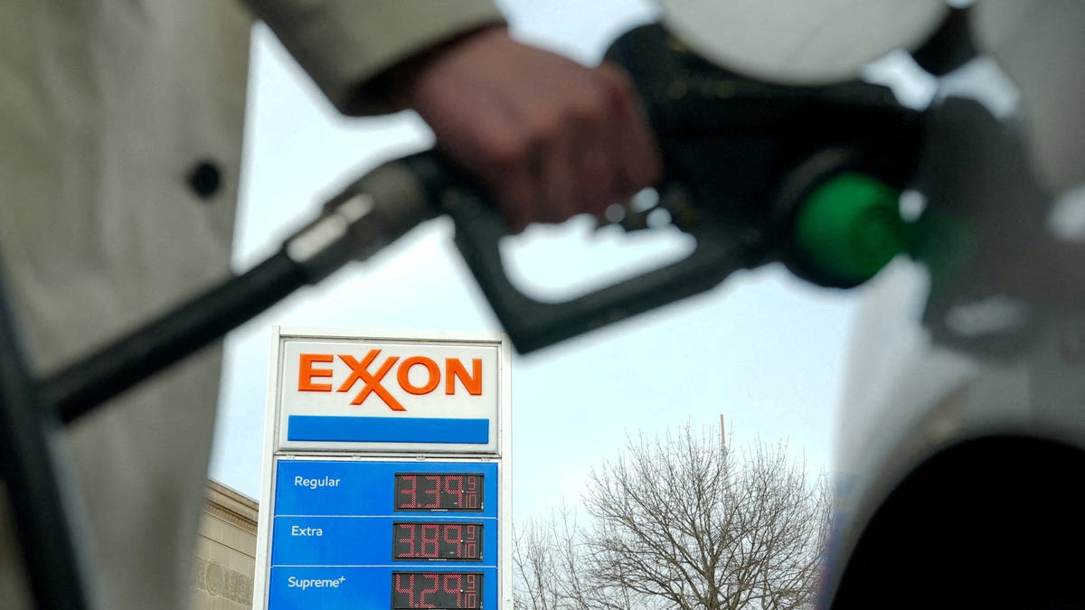 FILE PHOTO: A man pumps gas at an Exxon station as the price of oil and gas has surged amid the U.S.-Israeli conflict with Iran, in Washington, D.C., U.S., March 5, 2026. REUTERS/Ken Cedeno/File Photo