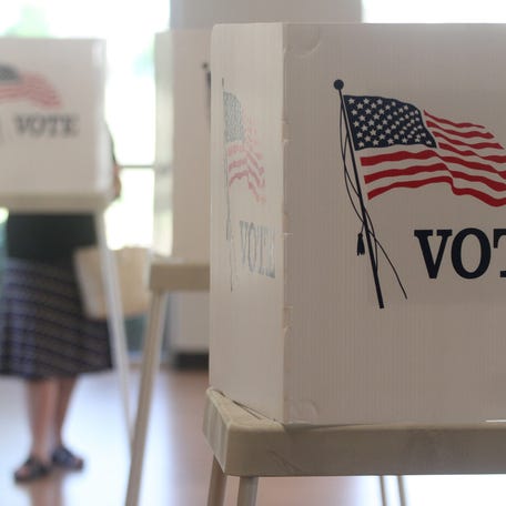 Voting booths stand ready for use in a U.S. election.