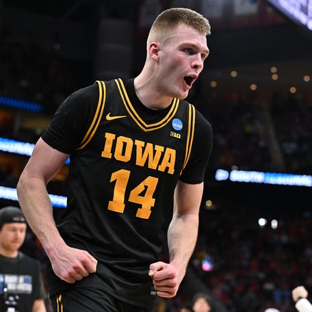 Mar 26, 2026; Houston, TX, USA;Iowa Hawkeyes guard Bennett Stirtz (14) reacts after beating the Nebraska Cornhuskers during a Sweet Sixteen game of the South Regional of the men's 2026 NCAA Tournament at Toyota Center. Mandatory Credit: Maria Lysaker-Imagn Images