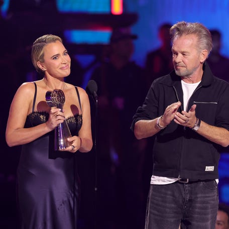Teddi Mellencamp Arroyave presents the iHeartRadio Icon Award to honoree and father John Mellencamp onstage at the 2026 iHeartRadio Music Awards at the Dolby Theatre on March 26, 2026, in Los Angeles.