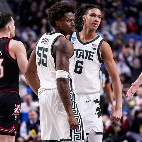 Michigan State forward Coen Carr (55) and forward Jordan Scott (6) celebrate a play against Louisville during the second round of the 2026 NCAA men's tournament at KeyBank Center.