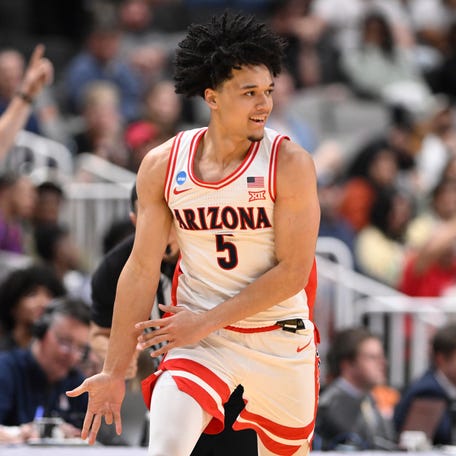 Arizona Wildcats forward Koa Peat (10) reacts after a pay against the Arkansas Razorbacks in the second half during a Sweet Sixteen game of the West Regional of the men's 2026 NCAA Tournament at SAP Center.