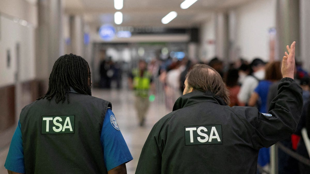 Transportation Security Administration (TSA) officers walk through the domestic terminal at Hartsfield-Jackson Atlanta International Airport in Atlanta, Georgia, U.S. March 27, 2026.