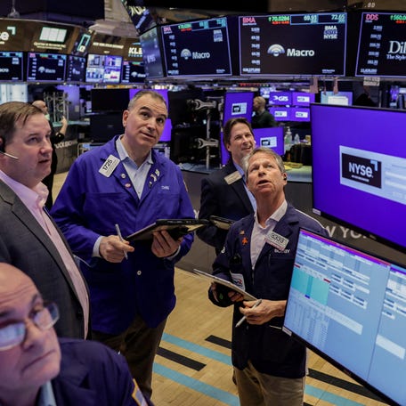 Traders work on the floor at the New York Stock Exchange (NYSE) in New York City, U.S., March 24, 2026. REUTERS/Jeenah Moon/File Photo