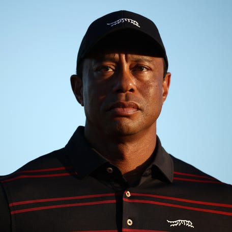 Tiger Woods stands on the 18th green for the trophy ceremony during the final round of the Hero World Challenge 2025 at Albany Golf Course in Nassau, Bahamas on Dec. 7, 2025.