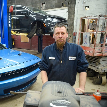 Justin Thaemert in his Foley, Minn., shop on Friday, March 27, 2026. Thaemert, 35, a co-owner of the Five Star Auto Repair shop in Foley, Minn., has seen business drop more than 60% since the U.S. war in Iran began nearly a month ago.