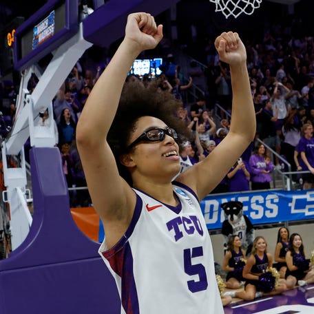 TCU guard Olivia Miles celebrates following the Horned Frogs' overtime victory over the Washington Huskies in the second round of the Women's NCAA Basketball Tournament on March 22, 2026.