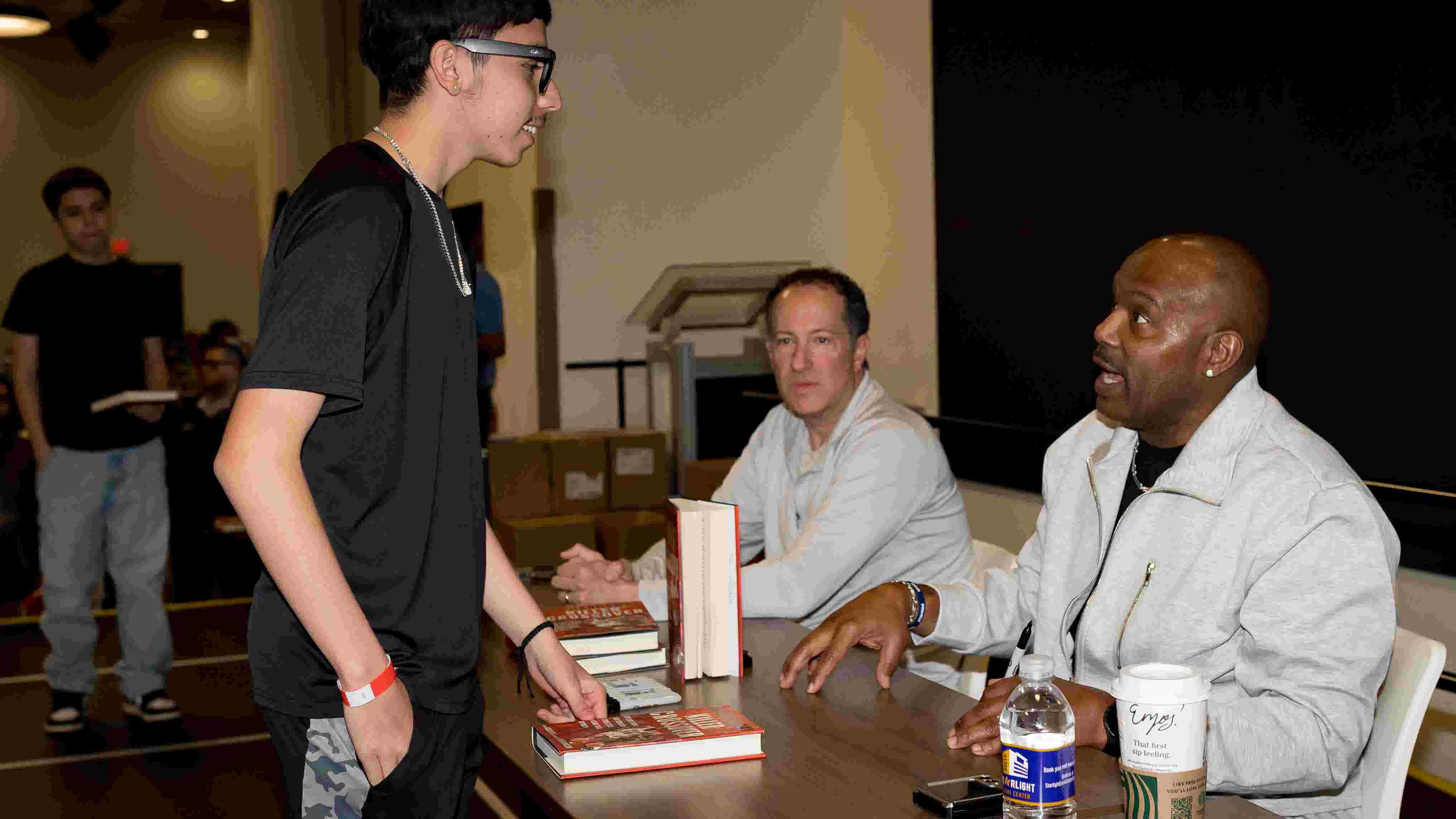 Tim Hardaway speaking to fans