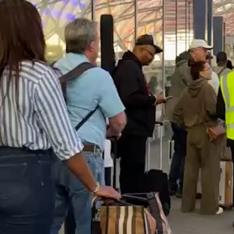TSA PreCheck lines stretch through Atlanta's airport as travelers face long waits during the partial government shutdown.