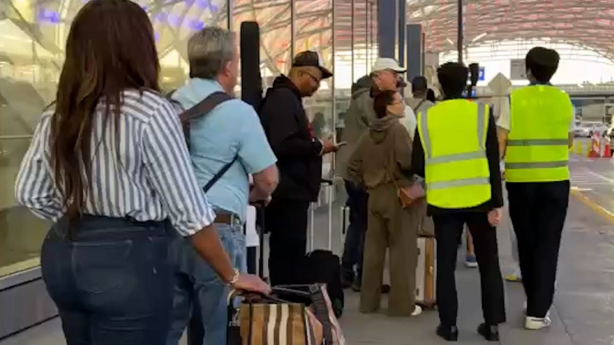 TSA PreCheck lines stretch through Atlanta's airport as travelers face long waits during the partial government shutdown.