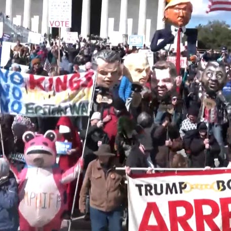 "No Kings" protesters took the streets of Washington, DC, with signs, chants and puppets resembling President Trump and his cabinet.