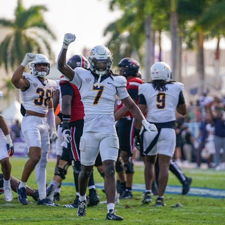 Toledo Rockets safety Emmanuel McNeil-Warren (7) celebrates a third down stop against the Louisville Cardinals during the third quarter of the Boca Raton Bowl at Flagler CU Stadium.