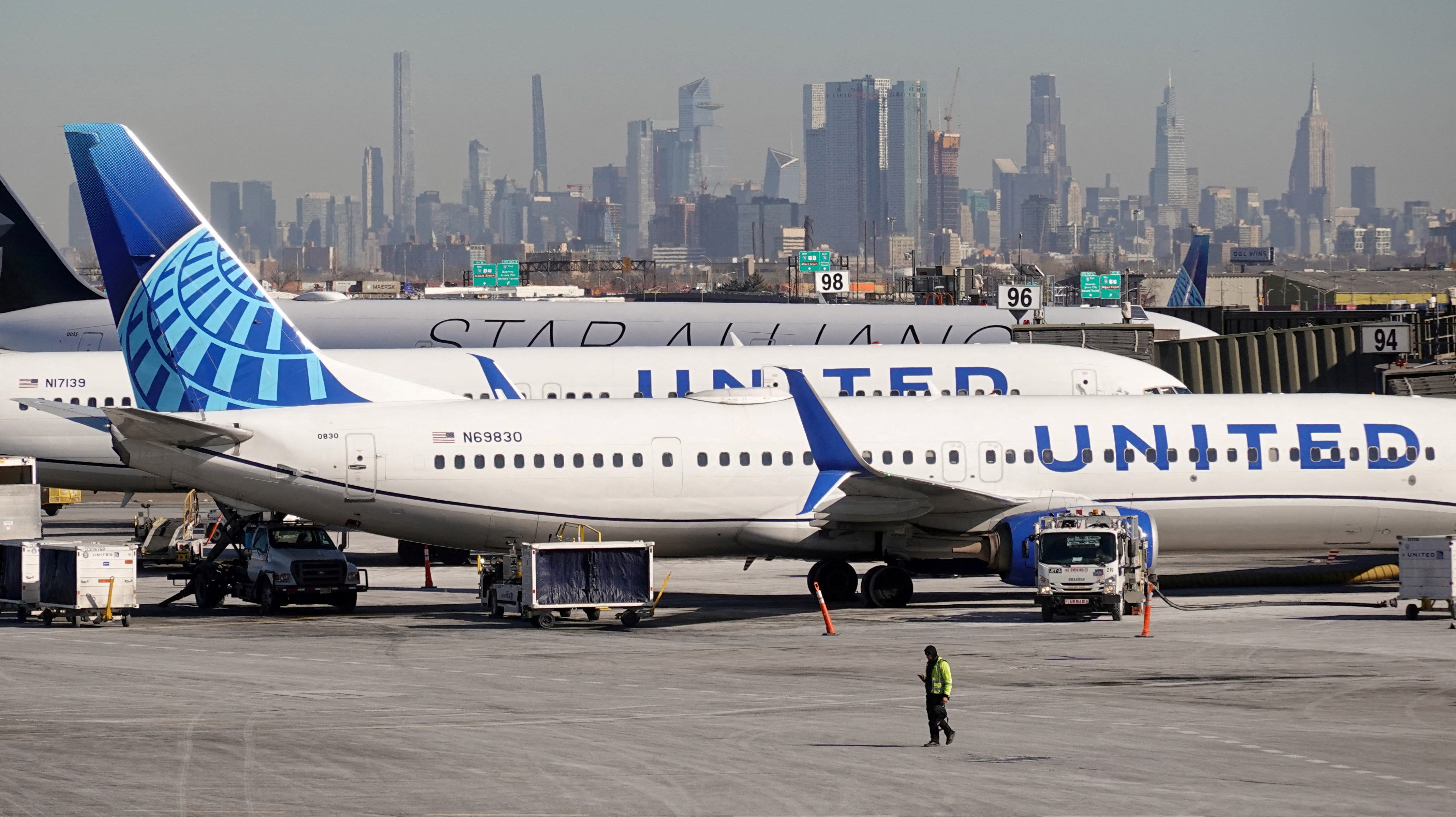 A tractor-trailer on the New Jersey Turnpike was damaged, and the driver sustained minor injuries, the airline company and officials said.