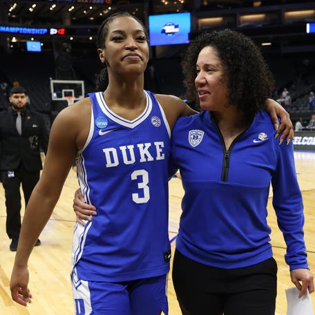 Head coach Kara Lawson of the Duke Blue Devils celebrates with Ashlon Jackson after defeating the LSU Tigers in the Sweet Sixteen of the 2026 NCAA Women's Basketball Tournament at Golden 1 Center on March 27, 2026 in Sacramento, California.