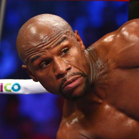 Floyd Mayweather and Manny Pacquiao box during their world welterweight championship bout at MGM Grand Garden Arena in Las Vegas on May 2, 2015.