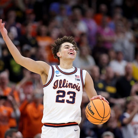 Keaton Wagler #23 of the Illinois Fighting Illini celebrates after defeating the Iowa Hawkeyes in the Elite Eight of the 2026 NCAA Men's Basketball Tournament at Toyota Center on March 28, 2026 in Houston, Texas.
