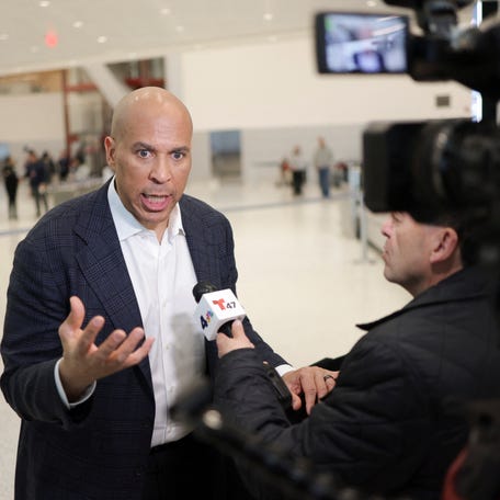 Sen. Cory Booker (D-NJ) speaks with the media at Newark Liberty International Airport, as hundreds of agents were ordered to deploy to airports to help fill TSA staffing gaps, in Newark, New Jersey, U.S., March 23, 2026.